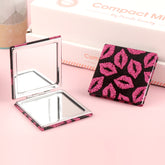 Showing Your Unique Charm, The PU Glitte Leather Makeup Mirror Is Embellished With Pink Lip Patterns, And The Plating Silver Metal Frame And 70*70mm Square Design Are Exquisite And Lightweight, Making It Beautiful Anytime And Anywhere